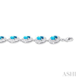 7x5 MM Oval Shape Blue Topaz and 1/10 ctw Round Cut Diamond Semi Precious Bracelet in Sterling Silver