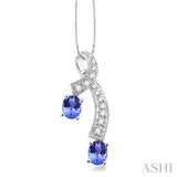 5x4MM Oval Cut Tanzanite and 1/6 Ctw Round Cut Diamond Pendant in 14K White Gold with Chain